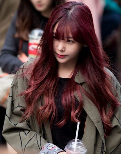 Raina with dark red hair