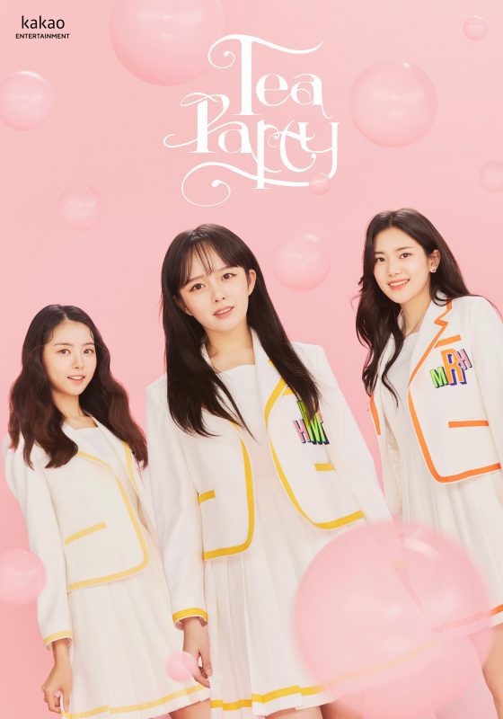 The female members of the group TEAPARTY alongside a pink background. They wear bright clothing. Hyunji, Maha and Ria.